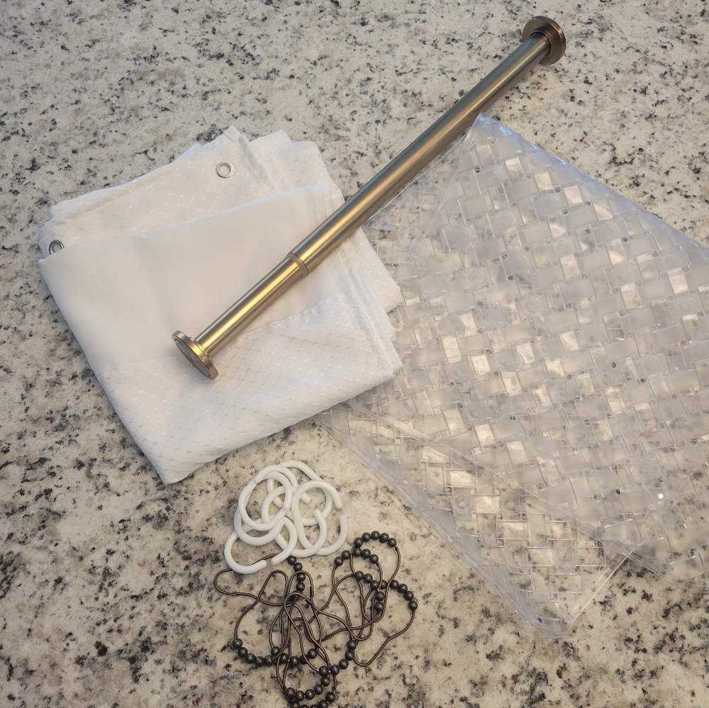 Shower rod, curtain, clip, and mat slip